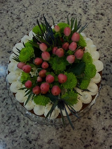 Decorated homemade cake with fresh flowers